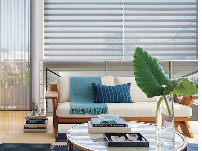 California style with white urban and wood sofa in front of matching Silhouette and Luminate shades